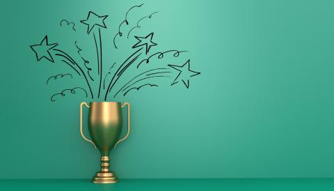 gold trophy with a green background