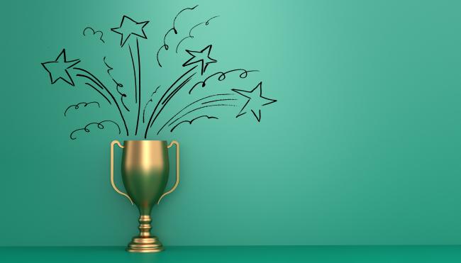 gold trophy with a green background